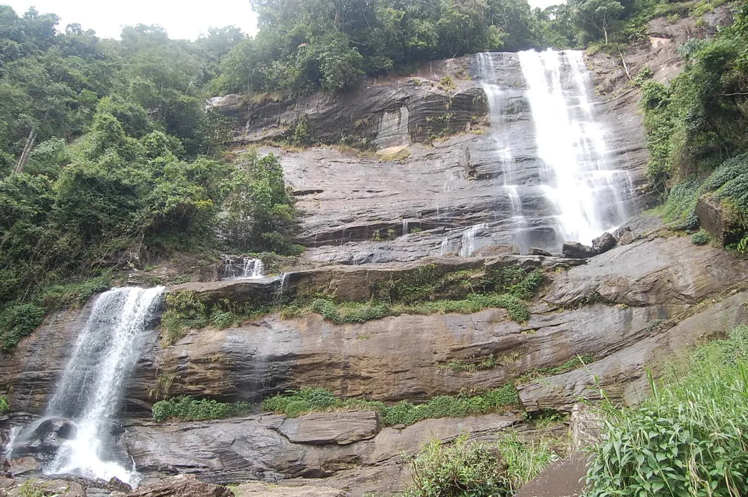 Alupola Ella waterfall plunging through forest near Ratnapura, Sri Lanka