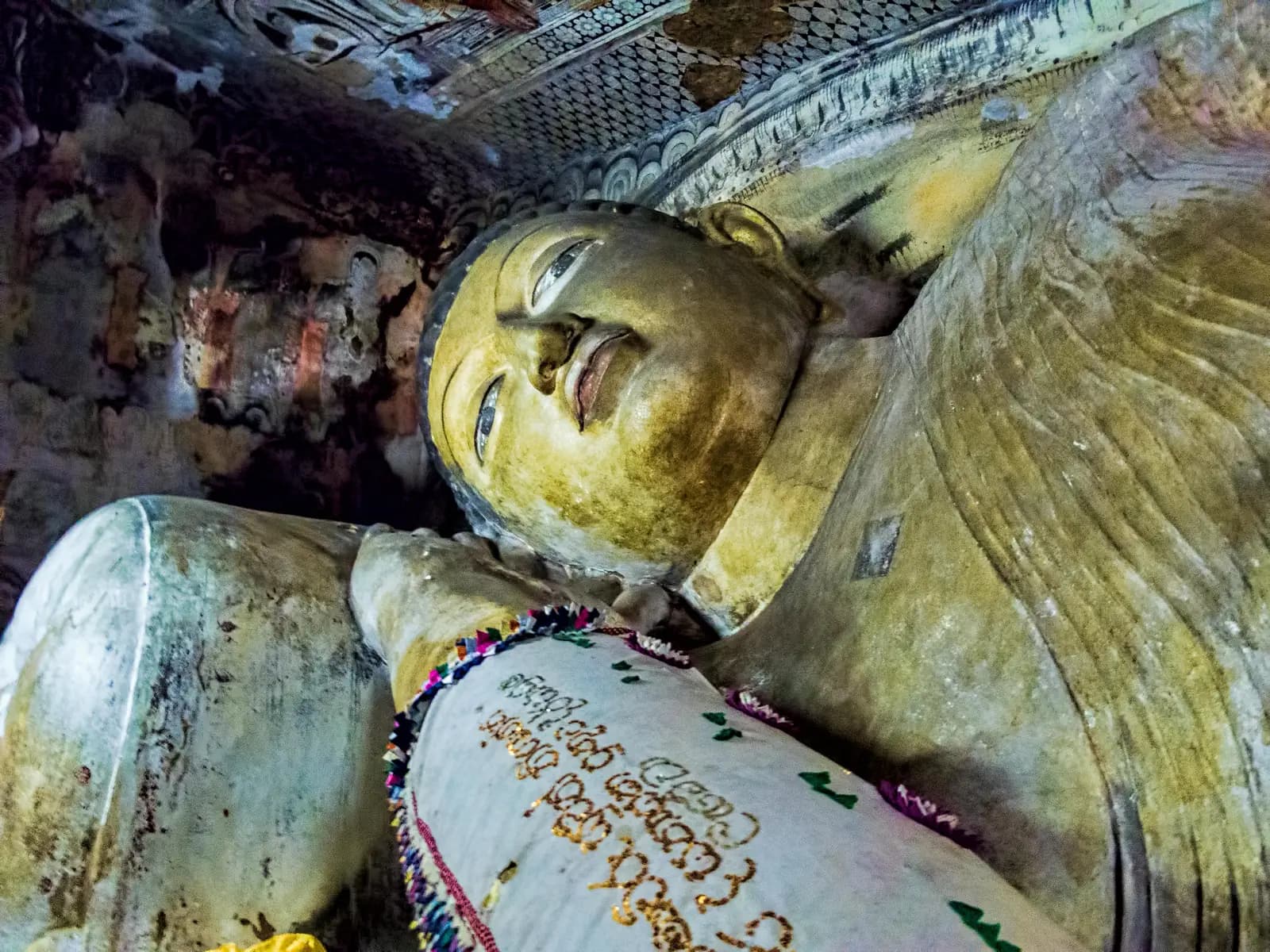 Rows of Buddha statues inside Dambulla Cave Temple, Sri Lanka