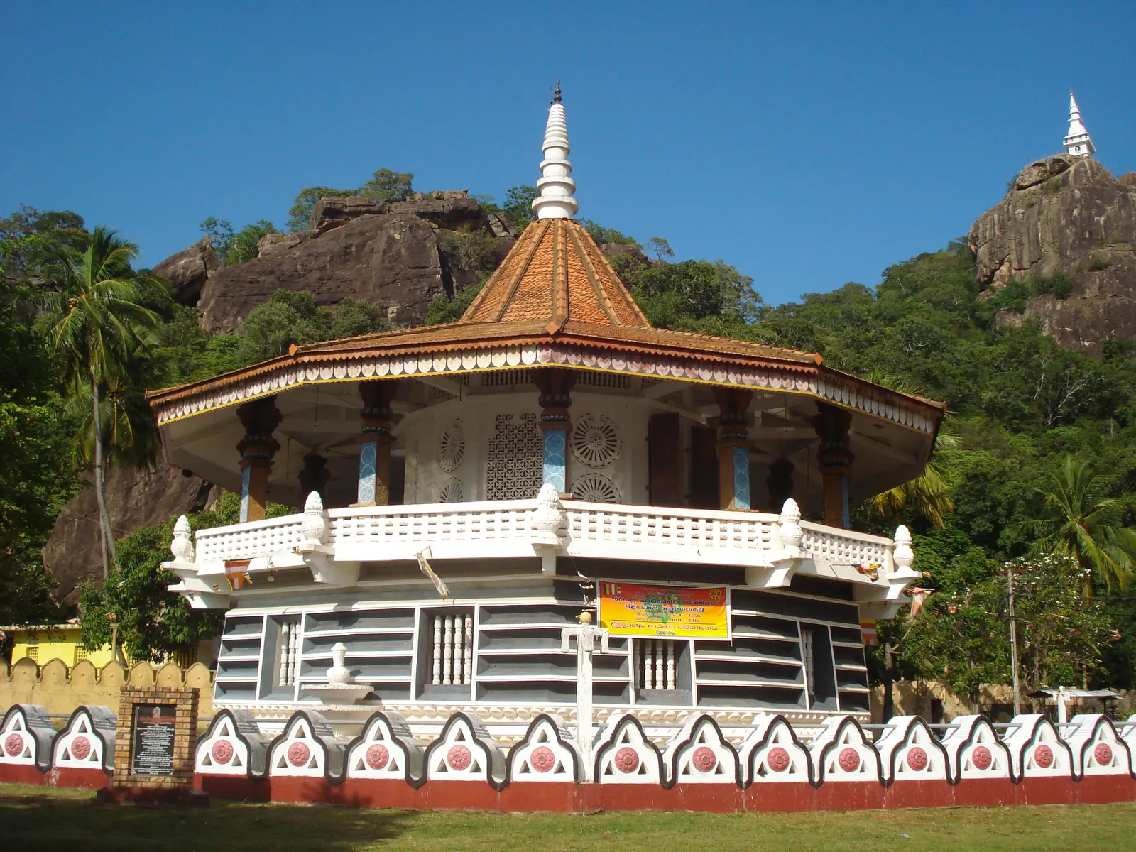 Dimbulagala monastery temple beneath its great rock, Sri Lanka