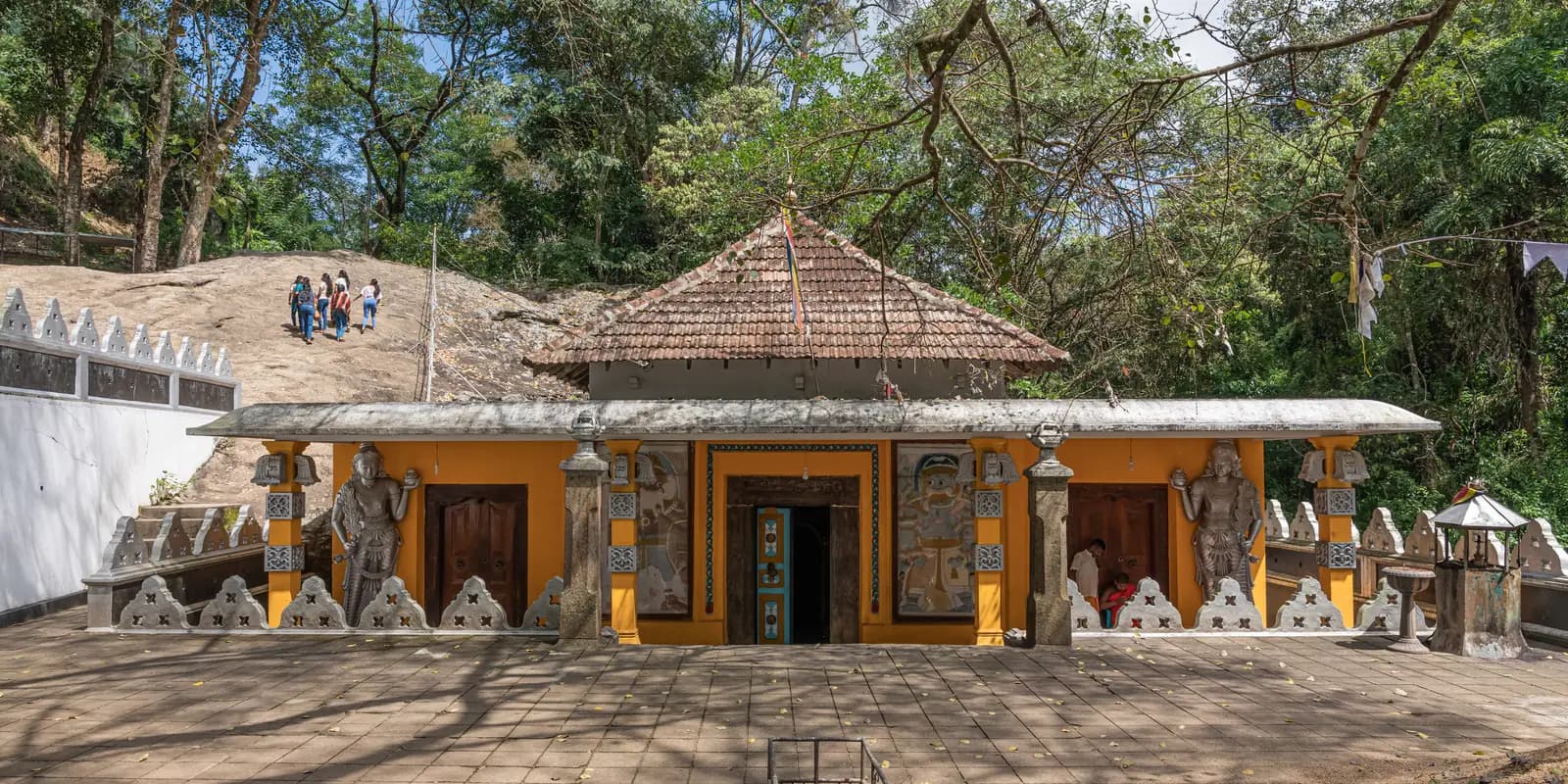 Rock face and shrine of Dowa Rock Temple near Ella, Sri Lanka