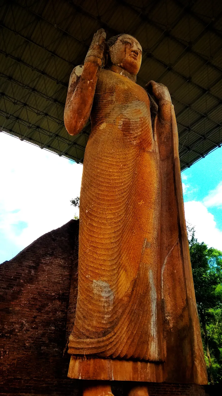 The 11-metre ancient limestone Buddha statue at Maligawila, Sri Lanka