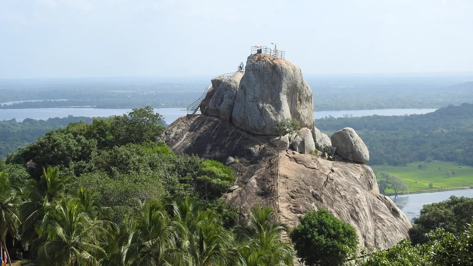 Sacred rock of Mihintale rising above the forest, Sri Lanka