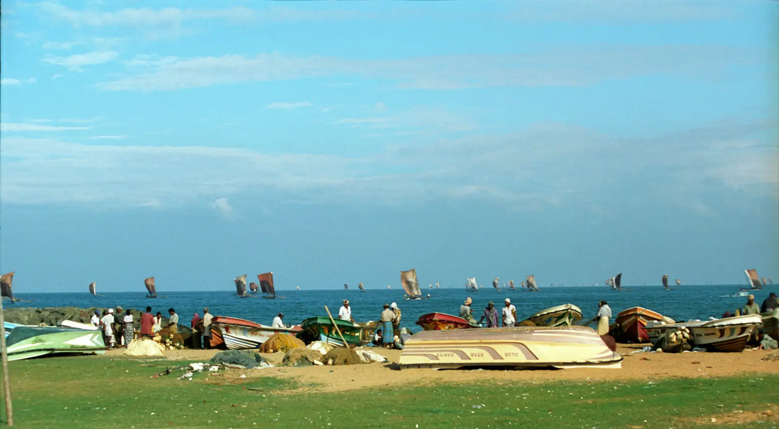 Fishermen hauling nets on Negombo beach, Sri Lanka