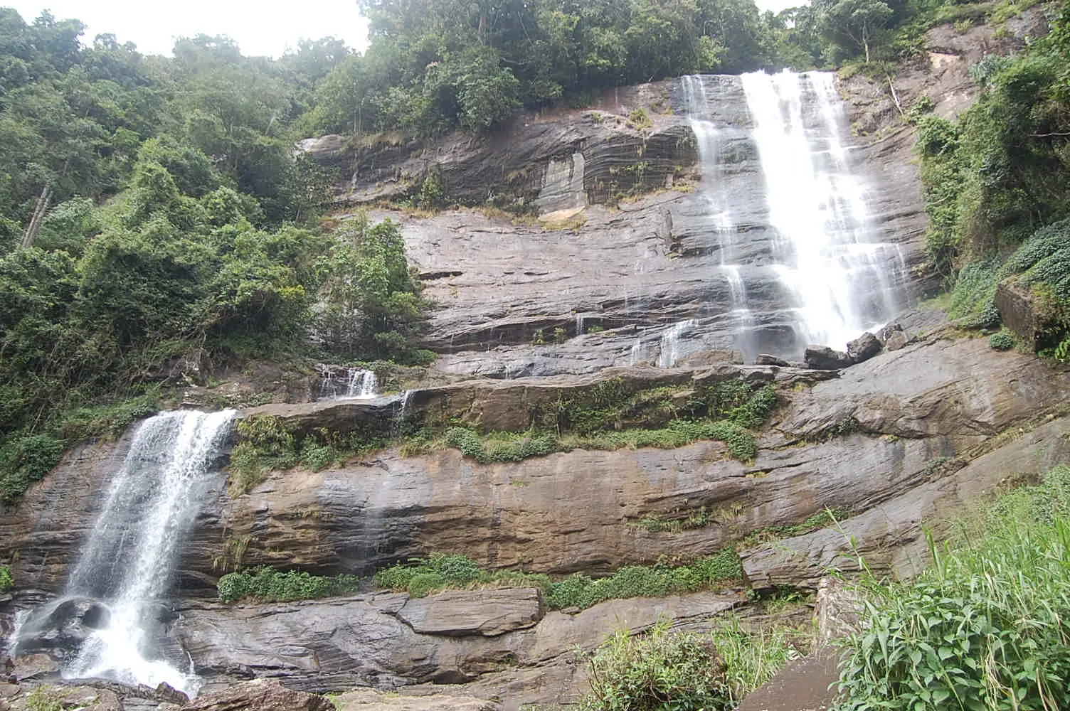 Alupola Ella waterfall plunging through forest near Ratnapura, Sri Lanka