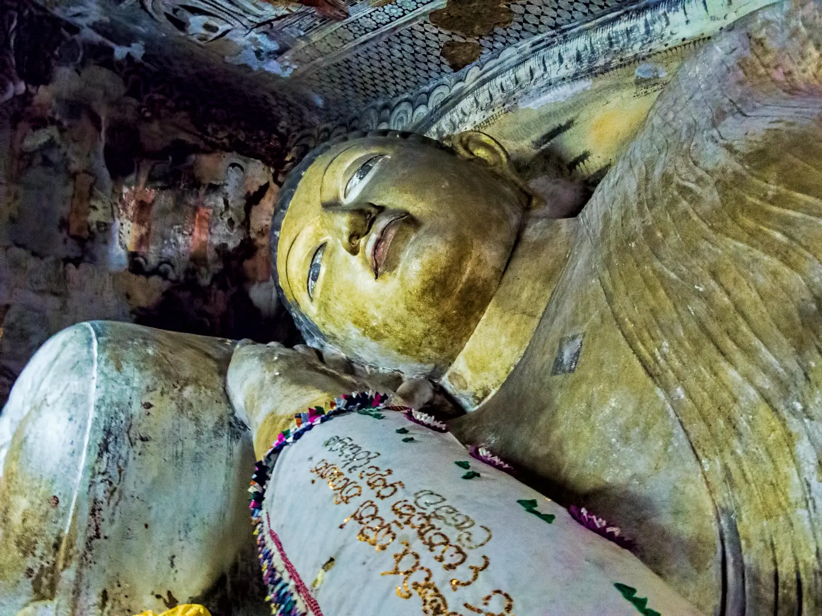 Rows of Buddha statues inside Dambulla Cave Temple, Sri Lanka